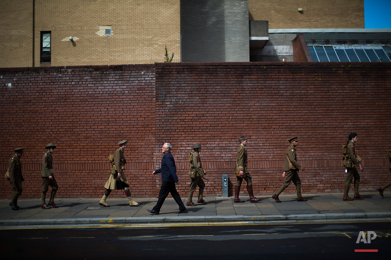  In this Saturday, July 2, 2016 photo, men wearing World War I era uniforms march in downtown Glasgow, as they commemorate the 100th anniversary of the Battle of the Somme.  (AP Photo/Emilio Morenatti)

 