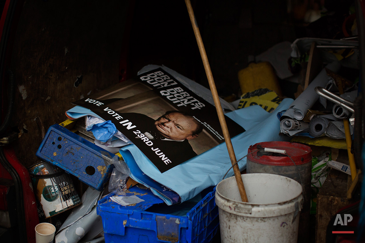  In this Friday, July 1, 2016 photo, a poster with a photo of Winston Churchill, calling for 
Britain to remain in the European Union, is placed inside a van after been removed from a wall in downtown Glasgow, Scotland. In one of the defining splits 