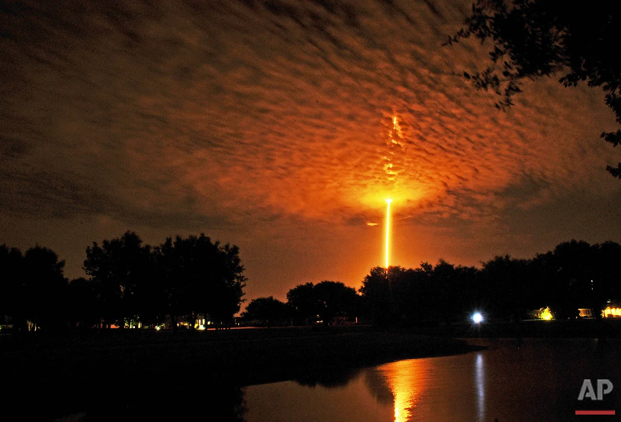A SpaceX Falcon 9 rocket launches from Cape Canaveral, seen from Woodside park in Viera, Fla., Monday, July 18, 2016. (Tim Shortt/Florida Today via AP)