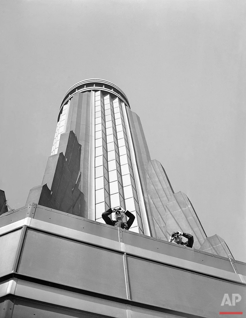  Spotters on the tower of the Empire State Building scan the skies for "enemy" planes, as maneuvers to perfect the defense of the north and central Atlantic seaboard against air attacks were started by the First Air Force in New York, Oct. 9, 1941. S