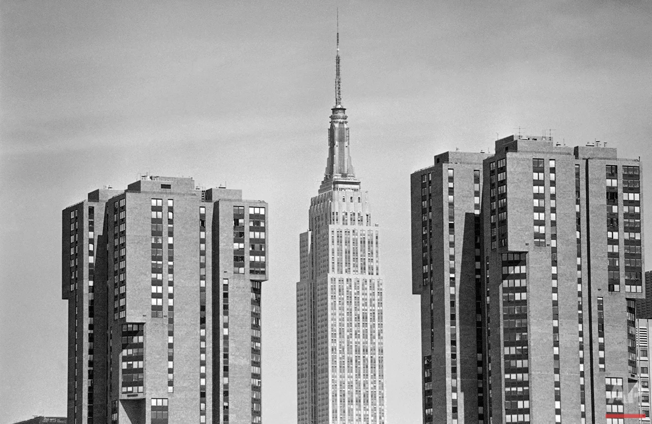  The landmark Empire State Building pierces the skyline as the main attraction flanked by the cubist-inspired Waterside Plaza apartments in New York, Aug. 7, 1982. The world’s third largest building rises 1,472 feet in the air with its 102 floors. (A