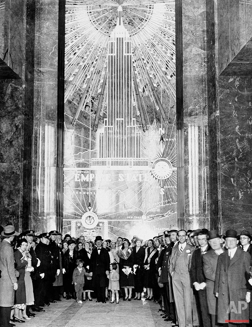 A general view in the lobby of the Empire State Building, May 1, 1931. Former Gov. Alfred E. Smith, with his grandchildren and party, are shown as they awaited the illumination of the building which was caused by the pushing of a button by President Hoover in Washington, D.C. This act officially opened the new building. (AP Photo)