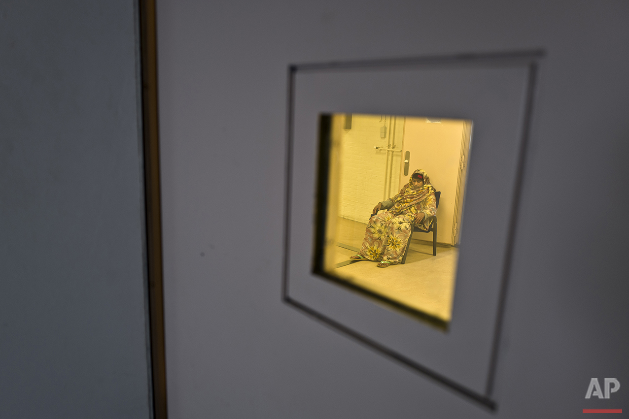  In this Tuesday, April 26, 2016 photo, Somali migrant Ijaawa Mohamed, 41, sits on a chair outside a room at the women section of the former prison of De Koepel in Haarlem, Netherlands. (AP Photo/Muhammed Muheisen) 