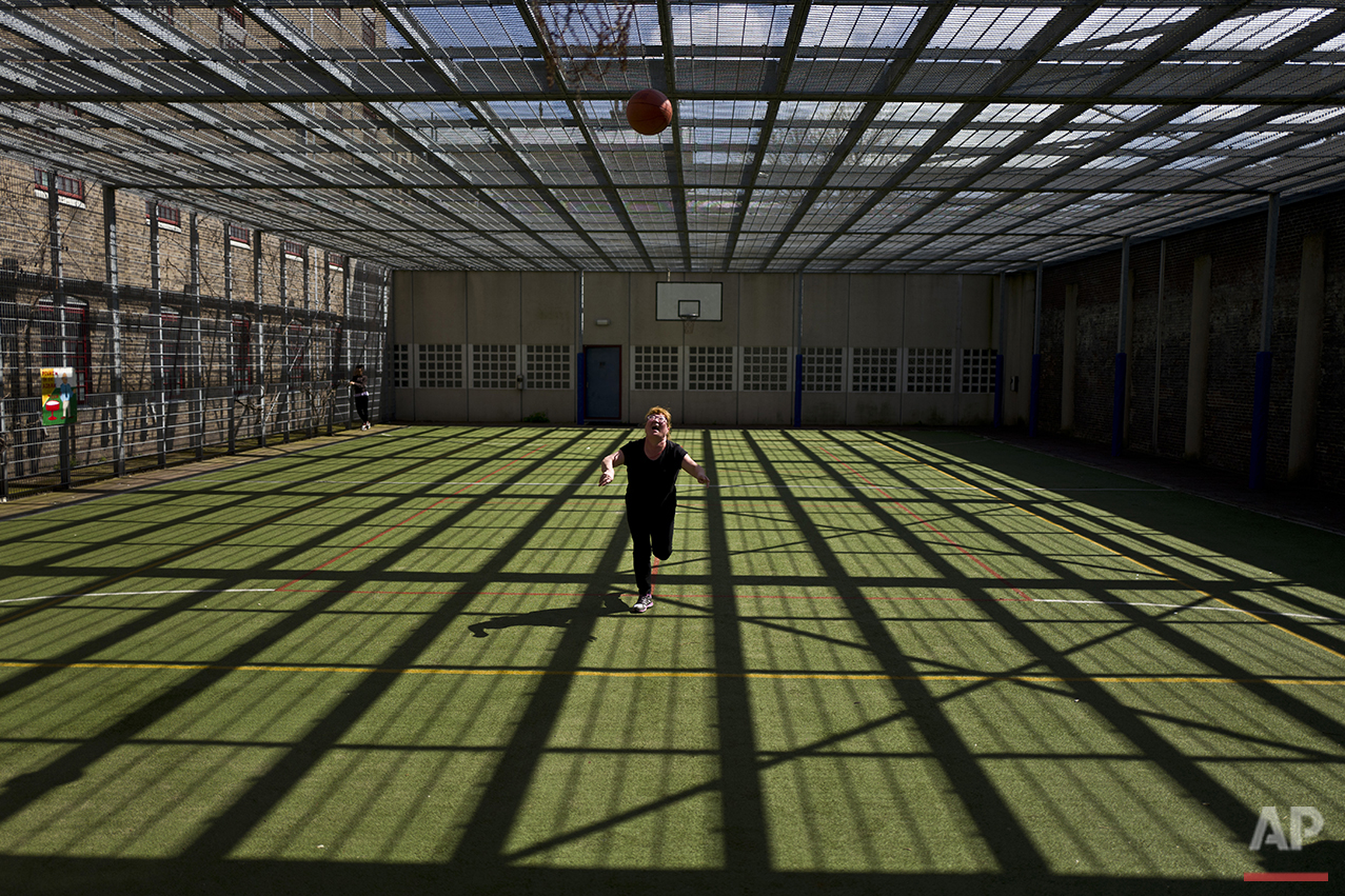  In this Wednesday, April 20, 2016 photo, Mongolian migrant Naaran Baatar, 40, plays basketball at a yard of the former prison of De Koepel in Haarlem, Netherlands. (AP Photo/Muhammed Muheisen) 