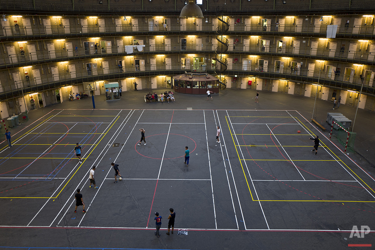  In this Tuesday, May 10, 2016 photo, refugees and migrants play football at the former prison of De Koepel in Haarlem, Netherlands. (AP Photo/Muhammed Muheisen) 