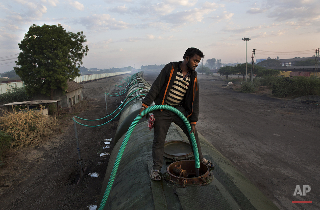  In this May 9, 2016, photo, a worker fills water in one of the many tanks of the Jaldoot water train at the Miraj railway station, Miraj, 340 kilometers (212 miles) from Latur, in the Indian state of Maharashtra. Many trains pull into Latur's railro
