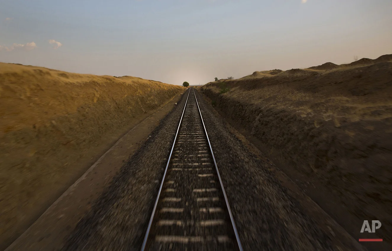  In this May 9, 2016, photo, parched land is seen on both sides of railway track as the Jaldoot water train makes it way to Latur from the Miraj railway station, Miraj, 340 kilometers (211 miles) from Latur, in the Indian state of Maharashtra. Many t