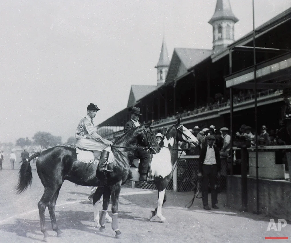 Black Gold is lead to the winner's circle after capturing the 50th Kentucky at Churchill Downs in Louisville, Ky., on May 17, 1924. (AP Photo)
