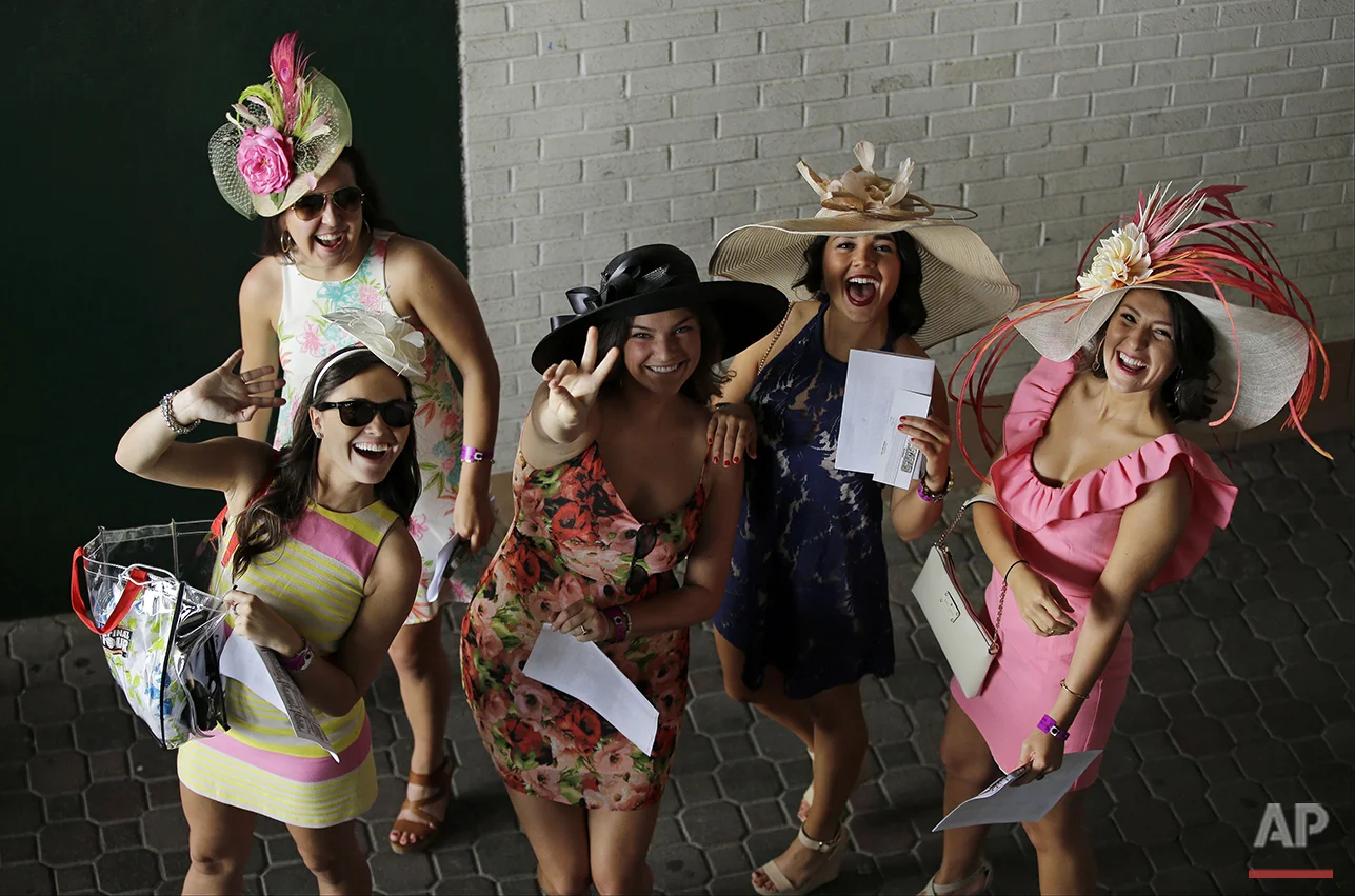 Fans arrive for the 141st running of the Kentucky Derby horse race at Churchill Downs, Saturday, May 2, 2015, in Louisville, Ky. (AP Photo/Matt Slocum)