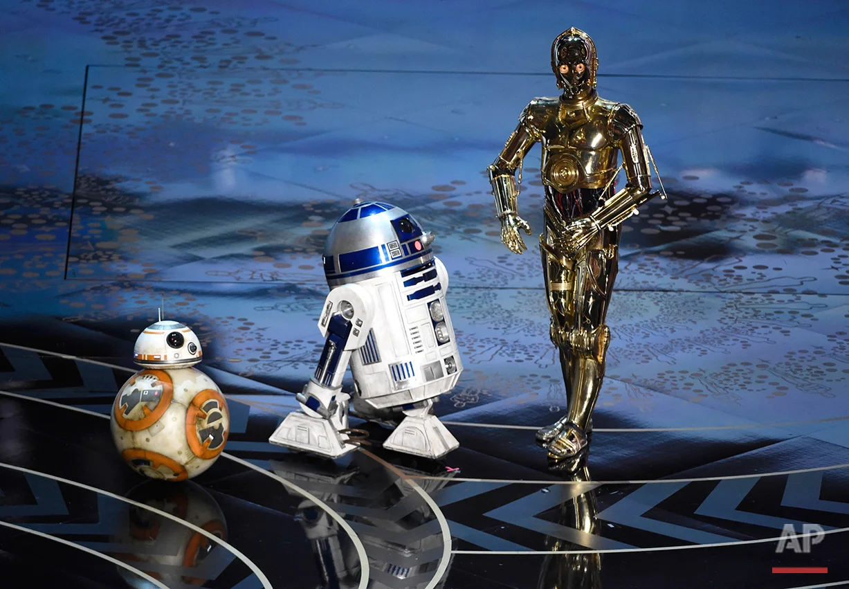 BB-8, from left, R2-D2, and C-3PO speak at the Oscars on Sunday, Feb. 28, 2016, at the Dolby Theatre in Los Angeles. (Photo by Chris Pizzello/Invision/AP)