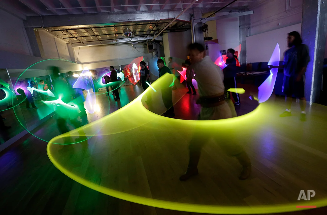 Jim Collum, foreground, and other students work on light saber skills during a Golden Gate Knights class in San Francisco, Sunday, Feb. 10, 2013. A group of San Francisco Star Wars fans who want to travel to a galaxy not that far away have created a combat choreography class for Jedis-in-training with their weapon of choice: the light saber. (AP Photo/Jeff Chiu)
