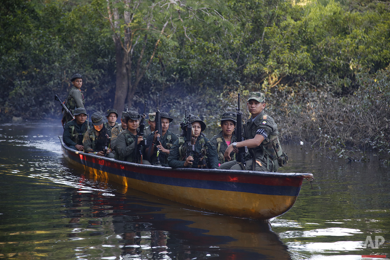  In this Aug. 11, 2016 photo, rebels of the 32nd Front of the Revolutionary Armed Forces of Colombia, or FARC, sit in a boat as they patrol the Mecaya River in the southern jungles of Putumayo, Colombia. (AP Photo/Fernando Vergara)&nbsp; 