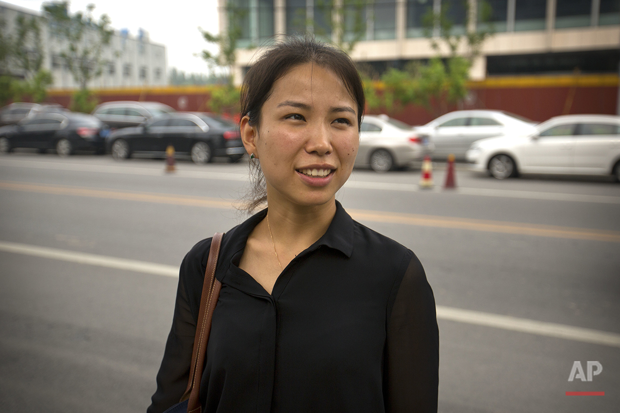  Liu Xiaodan, 30, a hotel manager, stands outside the U.S. embassy in Beijing on Friday, July 29, 2016. Of Americans, she says, "I think the way they are talking and dealing with personal relations is quite direct. They just like speaking their mind,