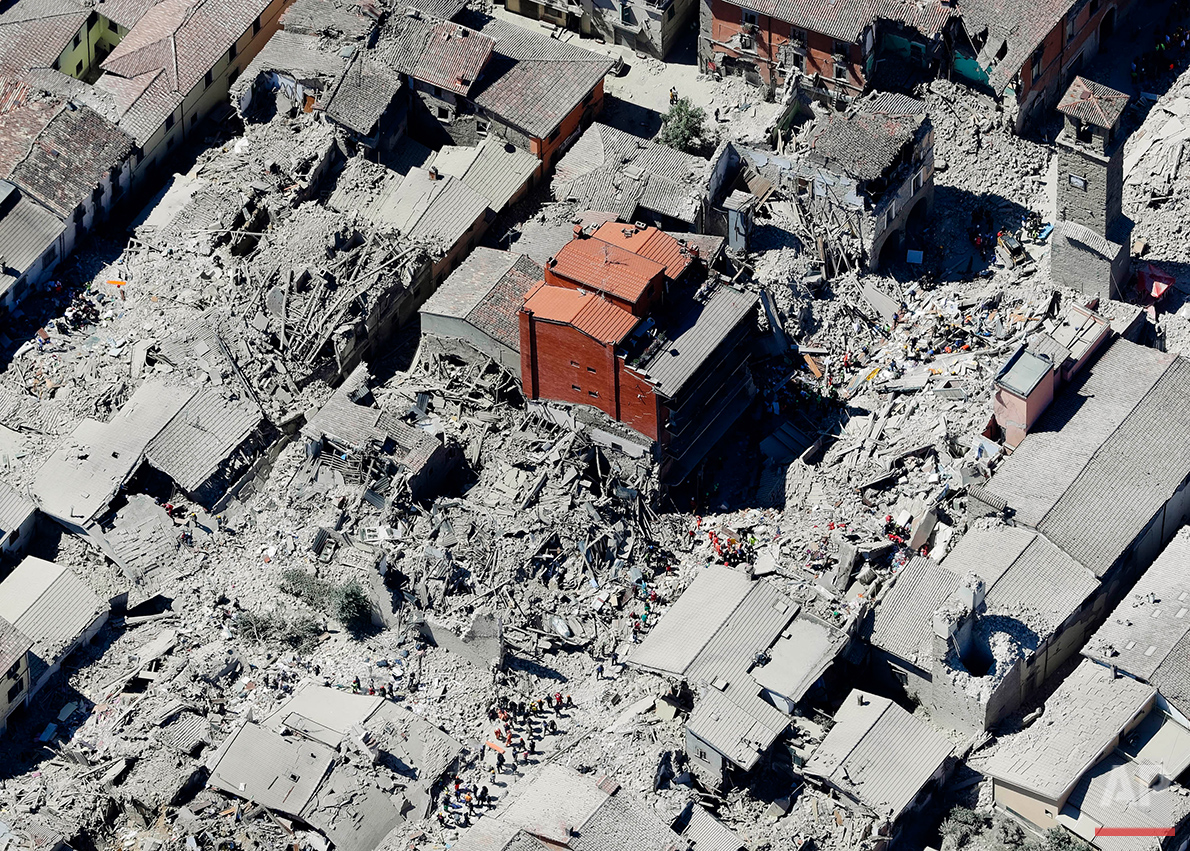  This aerial photo shows the earthquake-decimated historical area of Amatrice, Italy, Wednesday, Aug. 24, 2016. The deadly quake struck earlier in the morning and was felt across a broad swath of central Italy, including Rome. (AP Photo/Gregorio Borg