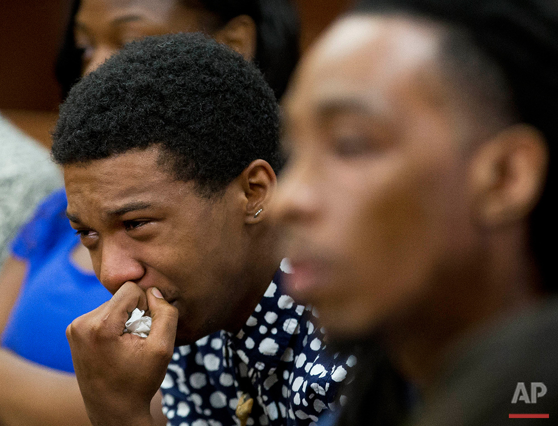  Marquez Tolbert cries Tuesday, Aug. 23, 2016 as he listens in Atlanta to testimony in the trial of Martin Blackwell who is accused of pouring boiling water on him and his friend, Anthony Gooden, right, as they slept. The FBI has decided not to pursu