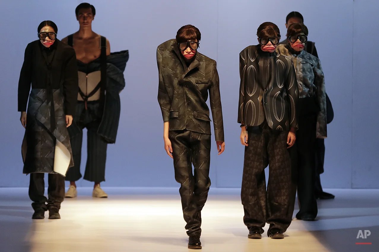  Models present creations for Beijing Institute of Fashion Technology Emerging Design Collection at the 'BIFT ELLASSAY' Scholarship Awarding Ceremony during China Fashion Week in Beijing, Tuesday, March 29, 2016. (AP Photo/Andy Wong) 