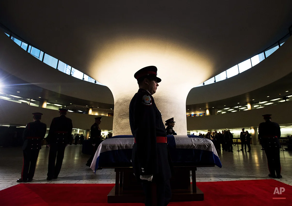  An honor guard stands by former Toronto Mayor Rob Ford's casket at city hall on Monday, March 28, 2016, in Toronto. Ford died of cancer at the age of 46. (Nathan Denette/The Canadian Press via AP)&nbsp; 