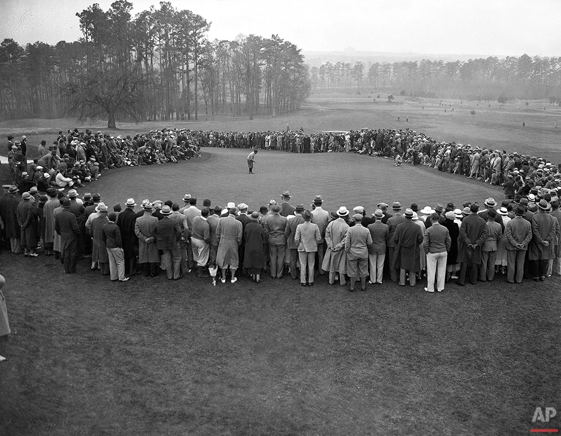 Bobby Jones misses a 20-foot putt, by an inch, on the green in second round play at the inaugural Augusta National Invitational Tournment in Augusta, Ga., on March 23, 1934. Jones scored a round total of 150. (AP Photo)