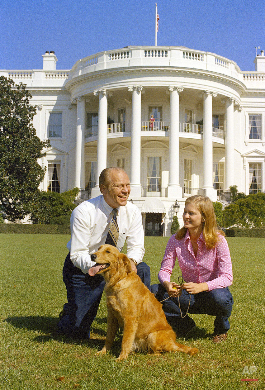 This Oct. 7, 1974 photo shows President Gerald Ford and his daughter, Susan, on the South Lawn of the White House with their dog, Liberty. (AP Photo)