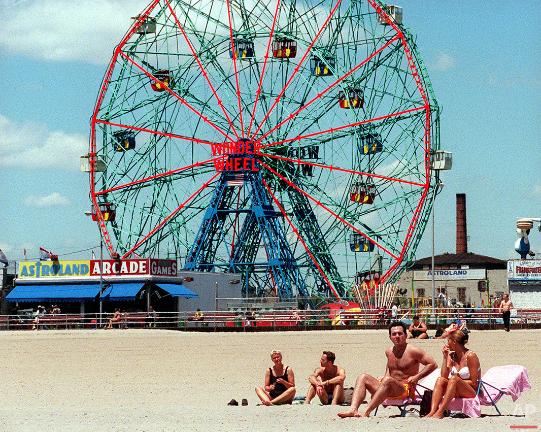 Beach goers take advantage of temperatures that reached into the mid-70's Friday, May 26, 2000, at New York's Coney Island. (AP Photo/Ed Bailey) 