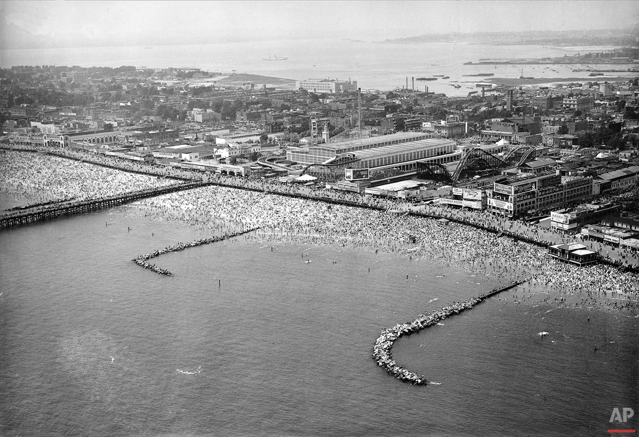 This aerial view shows the huge crowd that fills the water and beach at Coney Island in Brooklyn, N.Y., on Independence Day, July 4, 1937. (AP Photo)