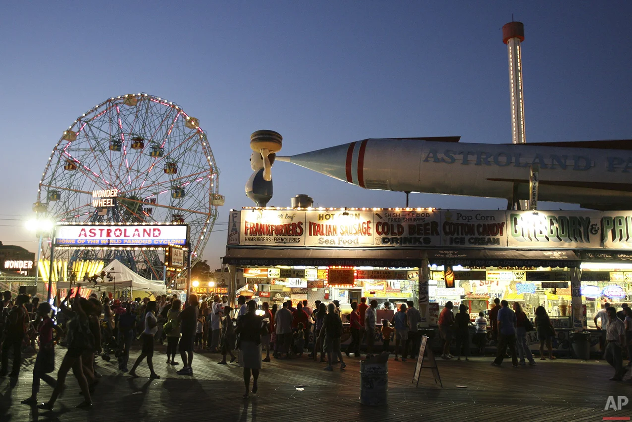 The entrance to Astroland Park is seen from the boardwalk at night at Coney Island, N.Y., Sunday, Sept. 7, 2008. (AP Photo/Seth Wenig)
