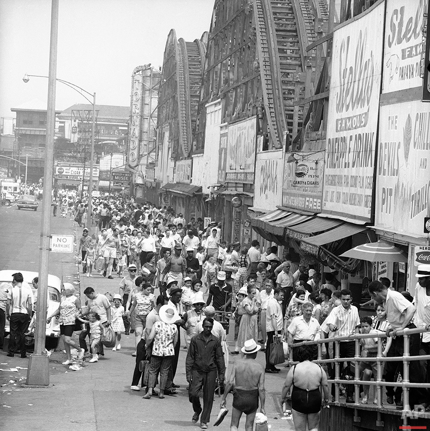  Mobs of people disgorge from the Surf Ave. subway station at Coney Island, New York on July 29, 1963, head for the beach and relief from a sweltering heat wave that has gripped the eastern seaboard for days. (AP Photo/John Lindsay) 