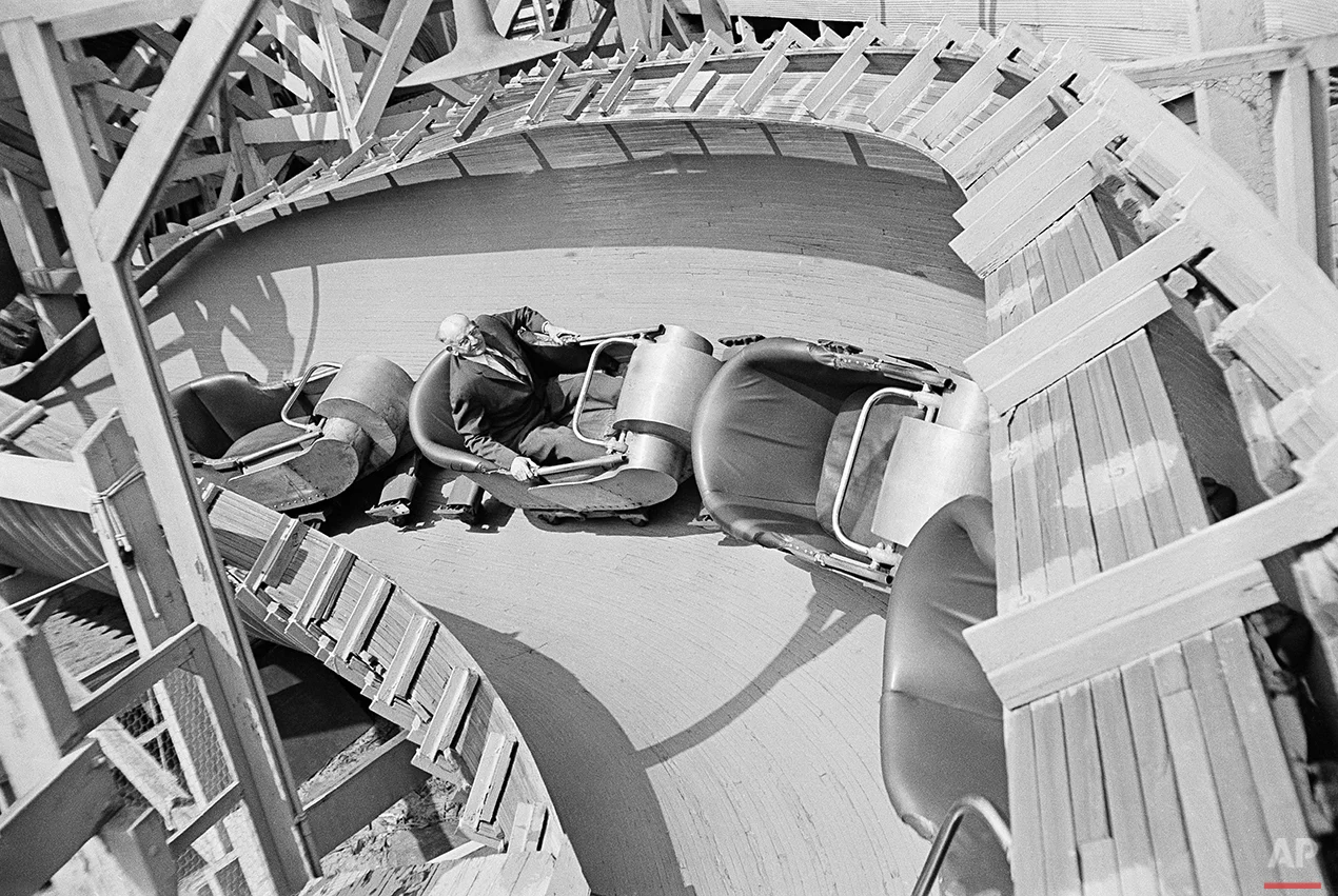 Bill Olsen, of Brooklyn, a New York elevator inspector, is shown on the job inspecting rides at Coney Island in the Brooklyn borough of New York, 1964, before the start of the summer season. (AP Photo)