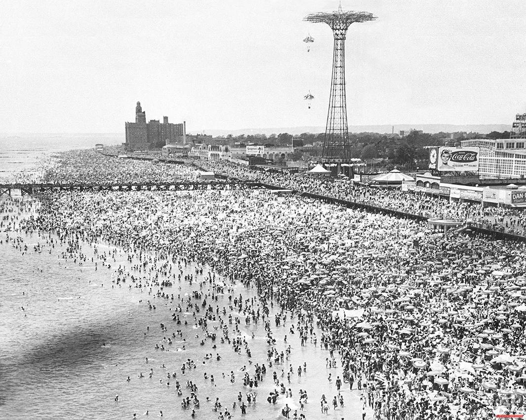 This aerial view shows sunbathers and swimmers at Coney Island in Brooklyn, N.Y., on Independence Day, July 4, 1961. (AP Photo)