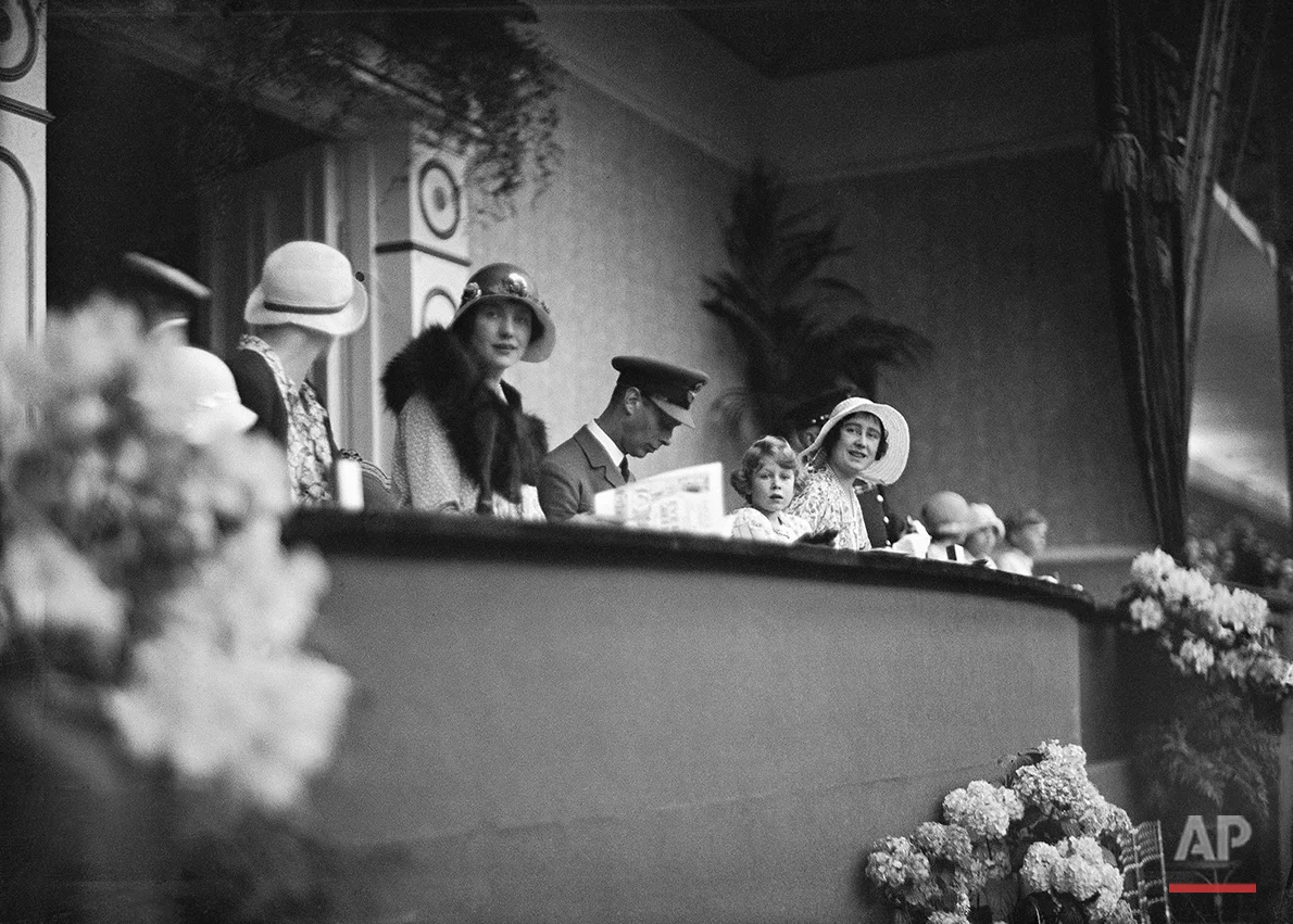 Britain's Princess Elizabeth with her parents Prince Albert and Lady Elizabeth Bowes Lyon, The Duke and Duchess of York in the RoyalBbox for the Royal Tournament at Olympia, London on June 5, 1931. (AP Photo/Staff/Putnam)