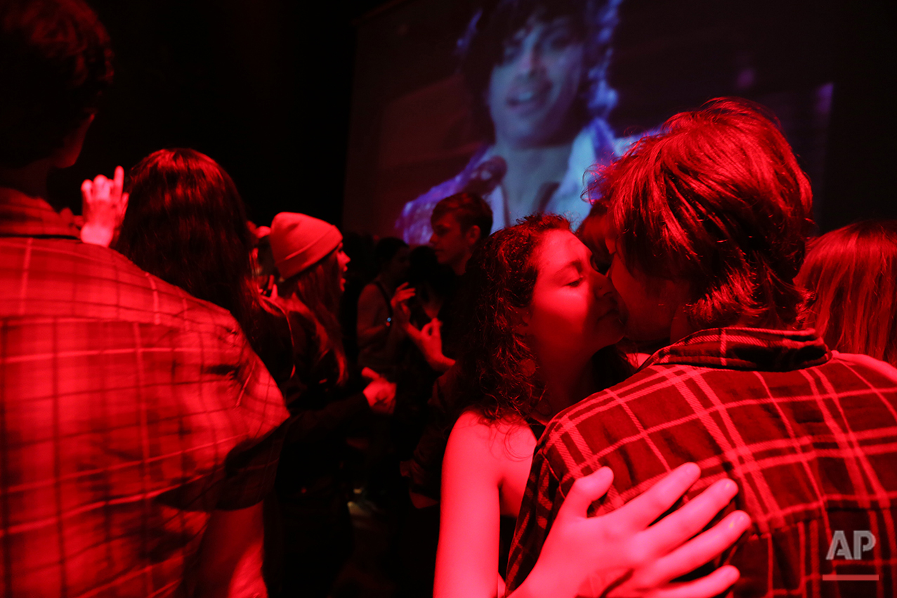  A crowd gathers outside of First Ave., a dance venue, to honor Prince in Minneapolis, on Thursday, April 21, 2016. Prince, widely acclaimed as one of the most inventive and influential musicians of his era with hits including "Little Red Corvette," 