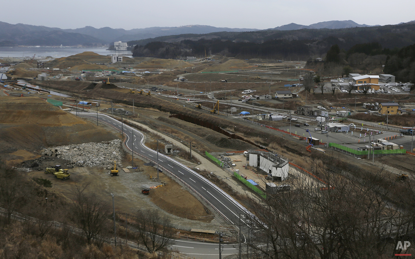  In this Monday, March 7, 2016 photo, construction works go on in the leveled city of Minamisanriku, Miyagi Prefecture, northeastern Japan, almost five years after the March 11, 2011 tsunami. (AP Photo/Eugene Hoshiko) 