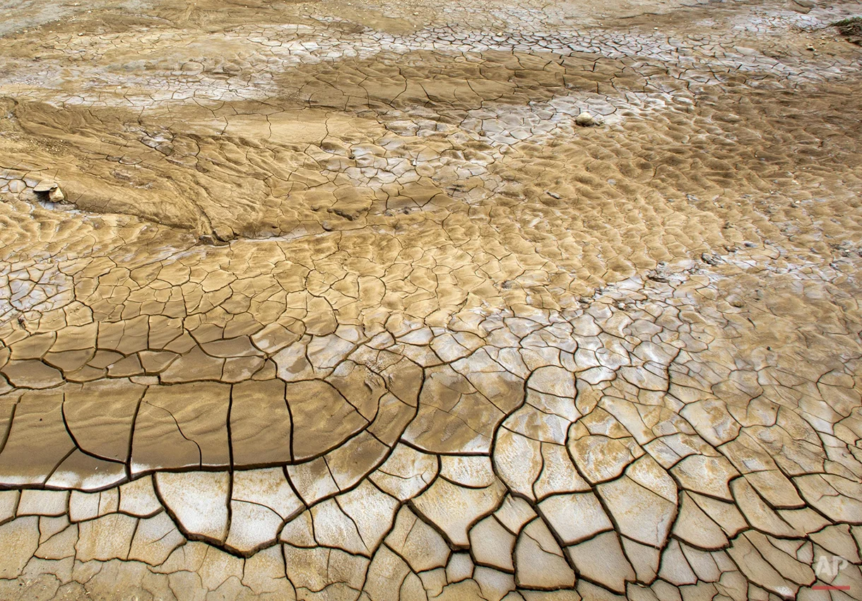  This Feb. 20, 2016 photo shows the dry, cracked lakebed of Trou Caiman, in Croix-des-Bouquets, Haiti. A drought worsened by the El Nino weather phenomenon has driven Haitians who were already barely getting by on marginal farmland deeper into misery