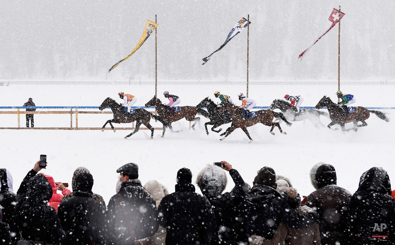  In this Feb. 15, 2015 photo, eventual winner Fox Kieren rides Berrahri, far left, as he competes during the GP Christoffel Bau Trophy on the frozen Lake St. Moritz on the second weekend of the White Turf races in St. Moritz, Switzerland. (Gian Ehren