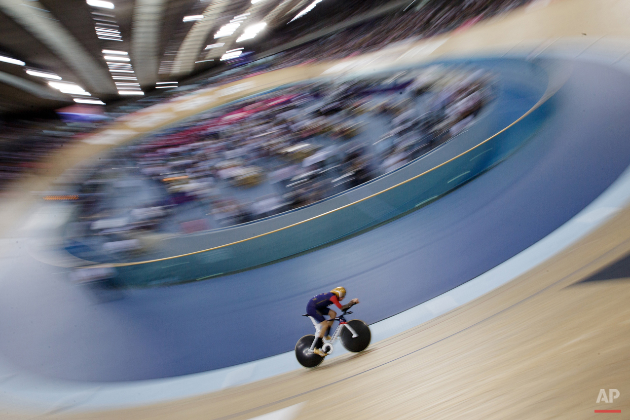  In this June 7, 2015 photo, Britain's Sir Bradley Wiggins rides on his way to breaking the UCI Hour Record at the Olympic Velodrome in Lee Valley Velopark, London. Former Tour de France winner Bradley Wiggins broke cycling's prestigious hour record,