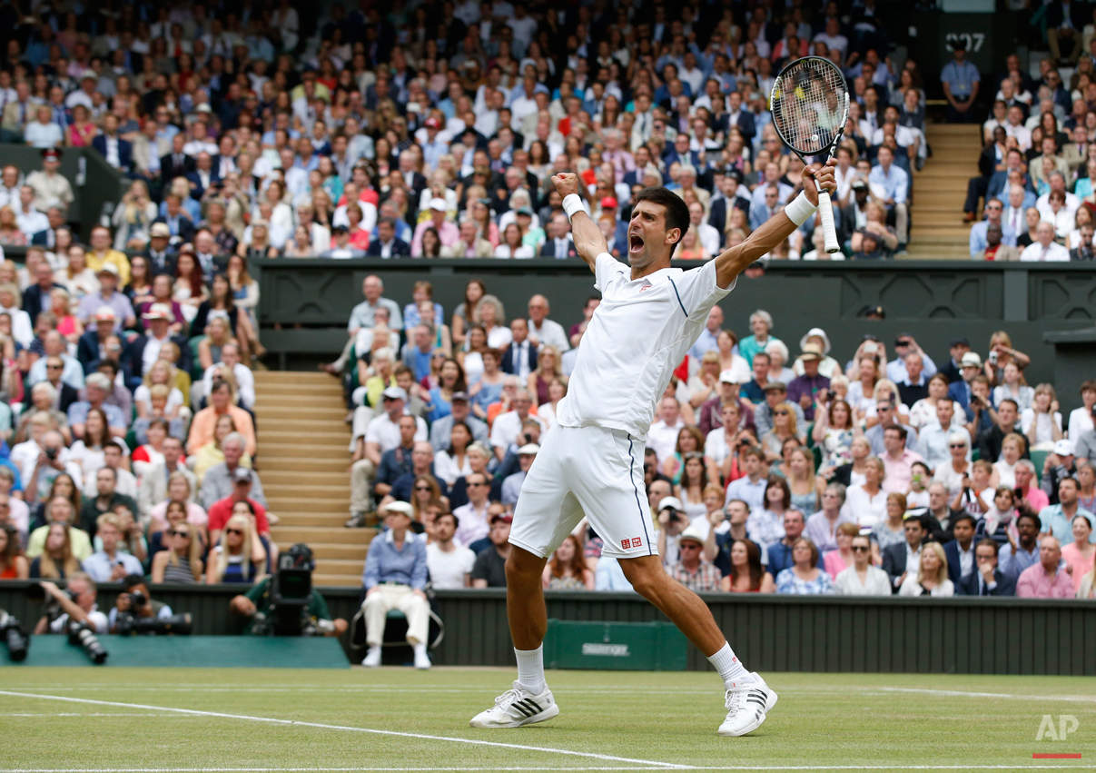  In this July 12, 2015 photo, Novak Djokovic of Serbia celebrates winning the men's singles final against Roger Federer of Switzerland at the All England Lawn Tennis Championships in Wimbledon, London. Djokovic won the match 7-6, 6-7, 6-4, 6-3. (AP P