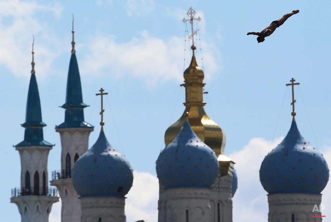 In this Aug. 3, 2015 photo Artem Silchenko of Russia competes during the men's 27 meter high dive competition at the Swimming World Championships in Kazan, Russia. (AP Photo/Denis Tyrin)
