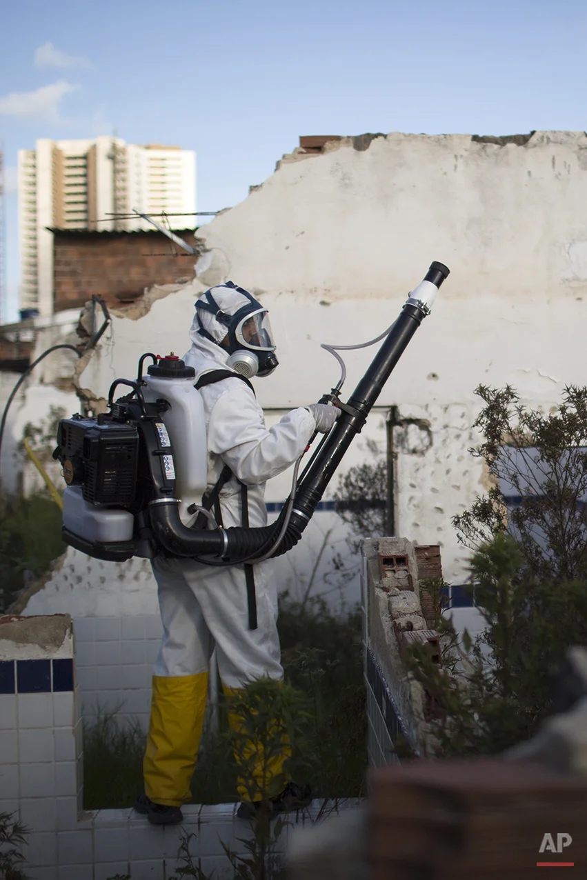  In this Jan. 26, 2016 photo, a municipal worker sprays insecticide to combat the Aedes aegypti mosquitoes that transmit the Zika virus, at the Imbiribeira neighborhood in Recife, Pernambuco state, Brazil. Brazil once succeeded in eliminating the Aed