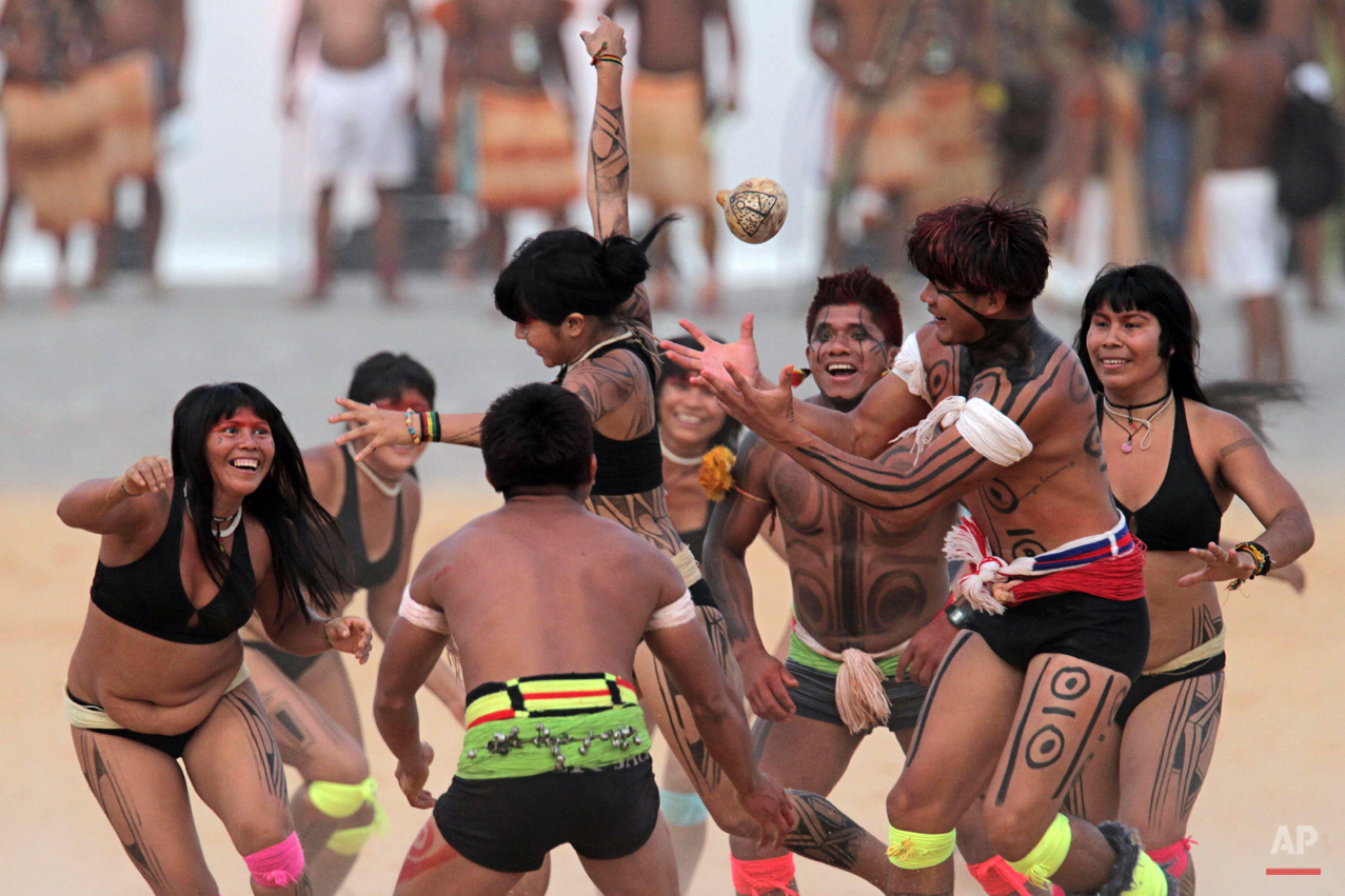In this Oct. 29, 2015, photo, Brazilís Kamayura indigenous people take part in a ball game with hands during the World Indigenous Games in Palmas, Brazil. Organizers billed the nine-day-long event as a sort of indigenous Olympics. (AP Photo/Eraldo Peres)