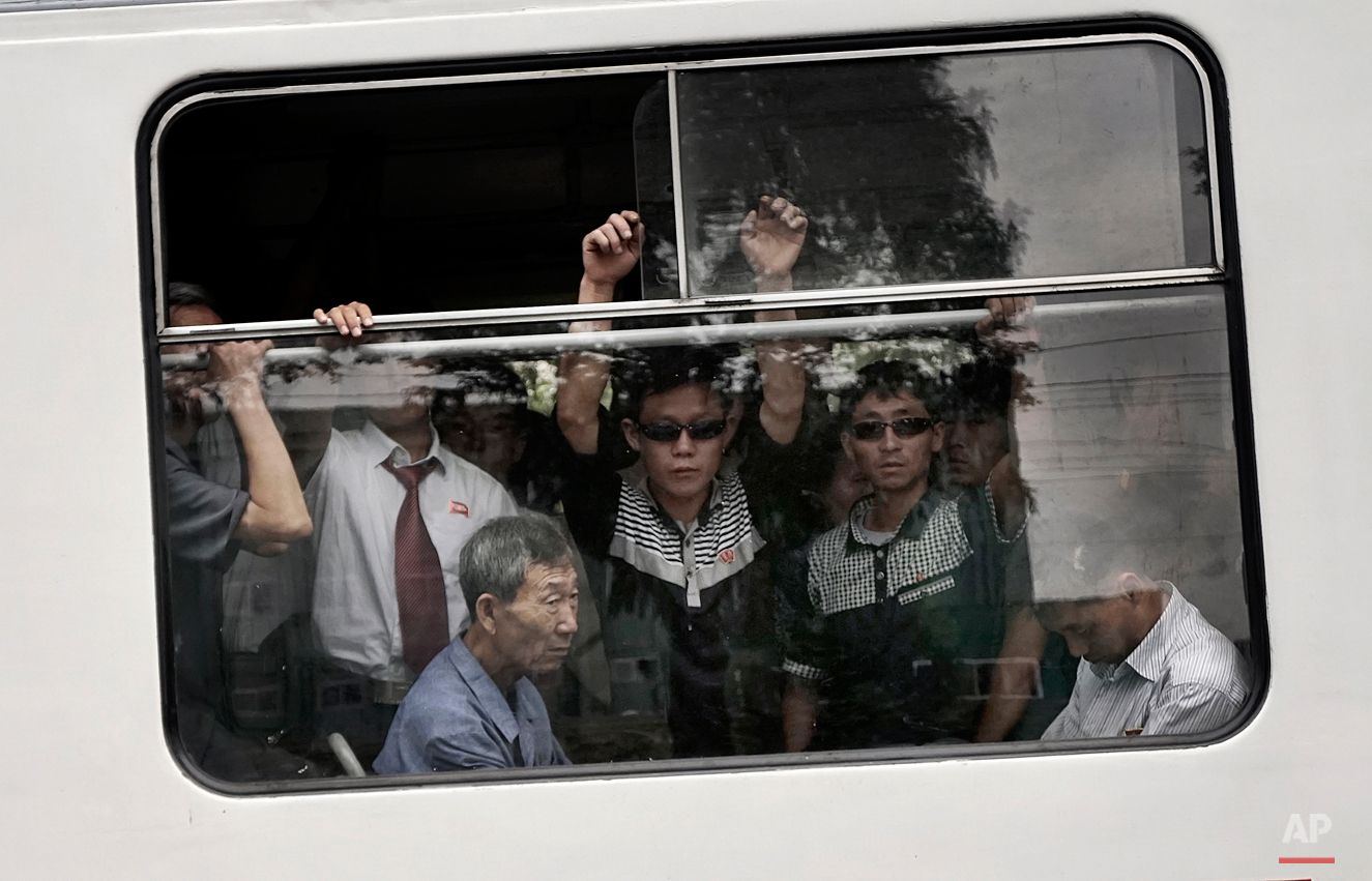  Commuters ride on a city trolley bus, Friday, Sept. 11, 2015 in Pyongyang, North Korea. The city trolley is one of the more common forms of public transportation among North Koreans living in Pyongyang. (AP Photo/Wong Maye-E) 