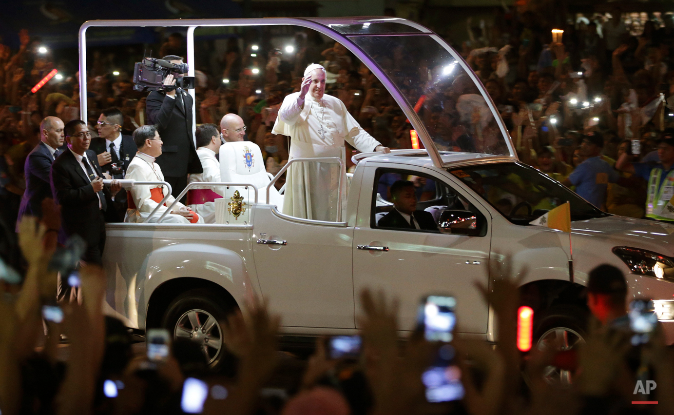  Pope Francis waves to Filipinos upon his arrival in Manila, Philippines, Thursday, Jan. 15, 2015. The Pope arrived in Manila for a pastoral visit which is expected to draw millions of faithful where about 81-percent of the population is Catholic. (A