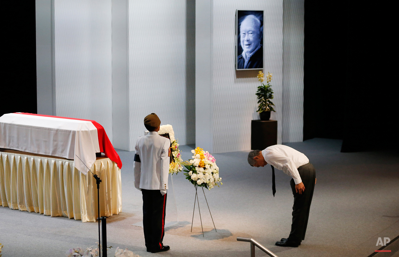  In this Sunday, March 29, 2015, photo, Singapore's Prime Minister Lee Hsien Loong pays his respects during a state funeral of the late Lee Kuan Yew, held at the University Cultural Center, in Singapore. During a week of national mourning that began 