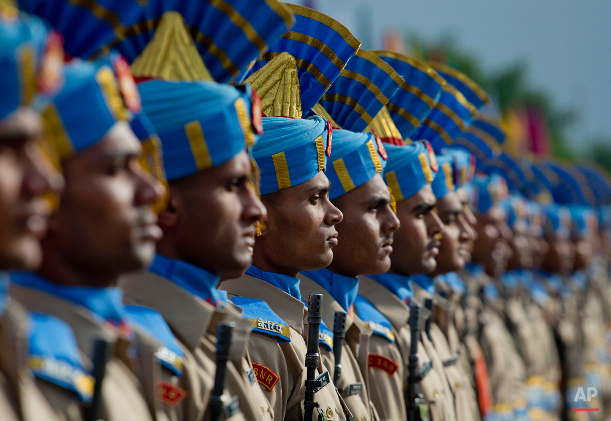  In this Thursday, May 14, 2015, photo, newly recruited members of the Indian Central Reserve Police Force (CRPF) stand during their commencement parade at a base camp on the outskirts of Srinagar, Indian controlled Kashmir. The new soldiers will joi