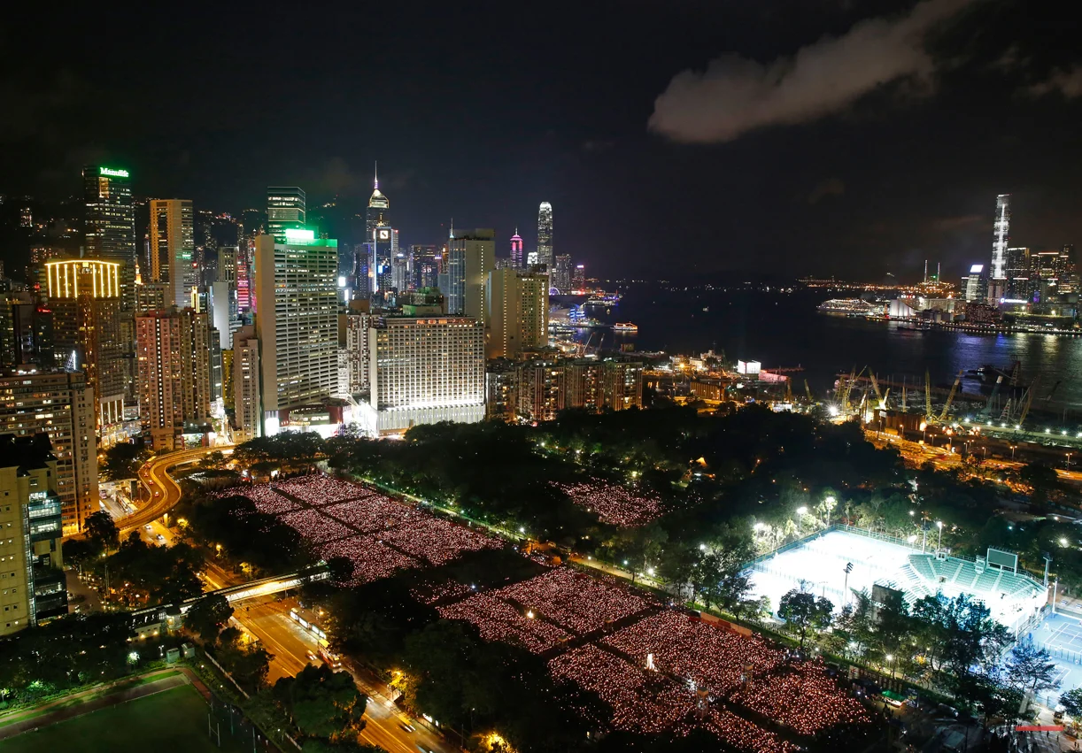 Tens of thousands of people attend a candlelight vigil at Victoria Park in Hong Kong on Thursday, June 4, 2015 to commemorate the 1989 student-led protests in Beijing's Tiananmen Square. (AP Photo/Kin Cheung)