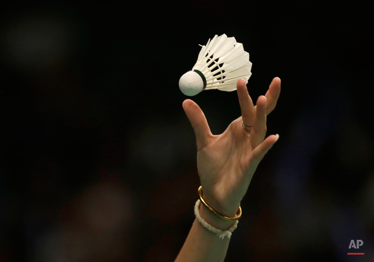  In this Thursday, June 4, 2015, photo, Ratchanok Intanon of Thailand serves against her compatriot Busanan Ongbumrungpan during their women's singles second round match at the Indonesia Open badminton tournament in Jakarta, Indonesia. (AP Photo/Dita