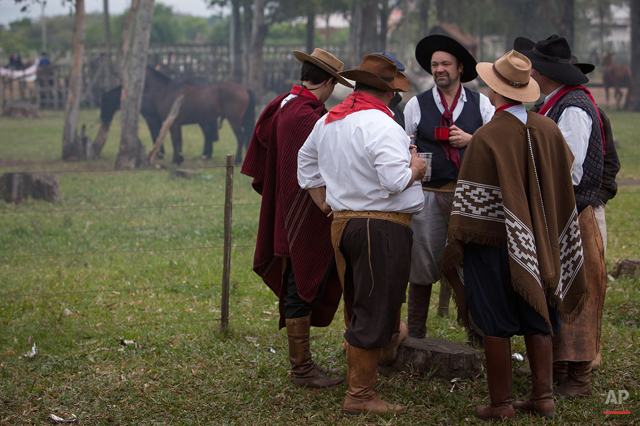  In this Sept. 20, 2015 photo, gauchos wearing traditional clothes gather before the Semana Farroupilha or “Ragamuffin” week in Alegrete municipality, Rio Grande do Sul state, Brazil. Celebrated every September, the regional revolt is known as the “R