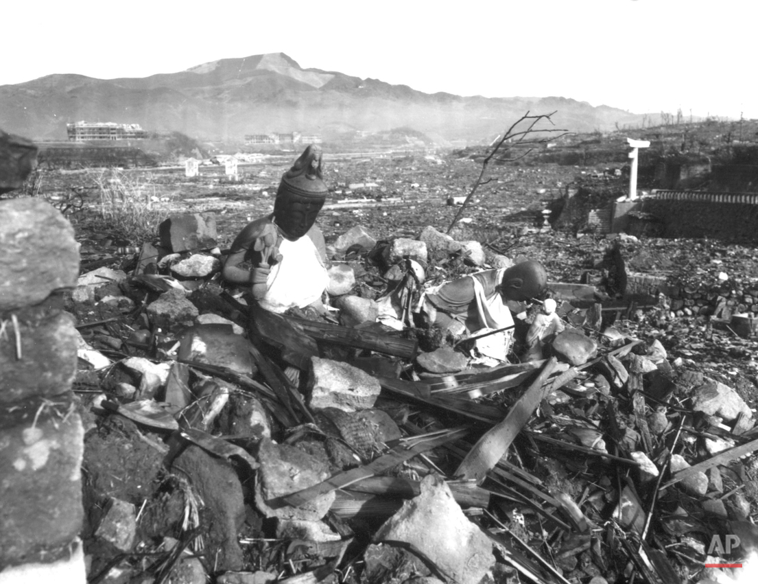  A battered religious figure stands witness on a hill above a burn-razed valley at Nagasaki, on September 24, 1945, after the second atomic bomb ever used in warfare was dropped by the U.S. over the Japanese industrial center. The bombing killed more
