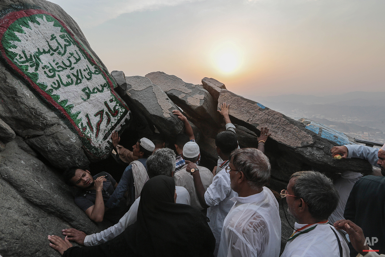  Muslim pilgrims queue atop Noor Mountain outside the Hiraa cave, where Prophet Muhammad received his first revelation from God to preach Islam, on the outskirts of Mecca, Saudi Arabia, Friday, Sept. 18, 2015. Hajj is expected to start on Monday. Mor