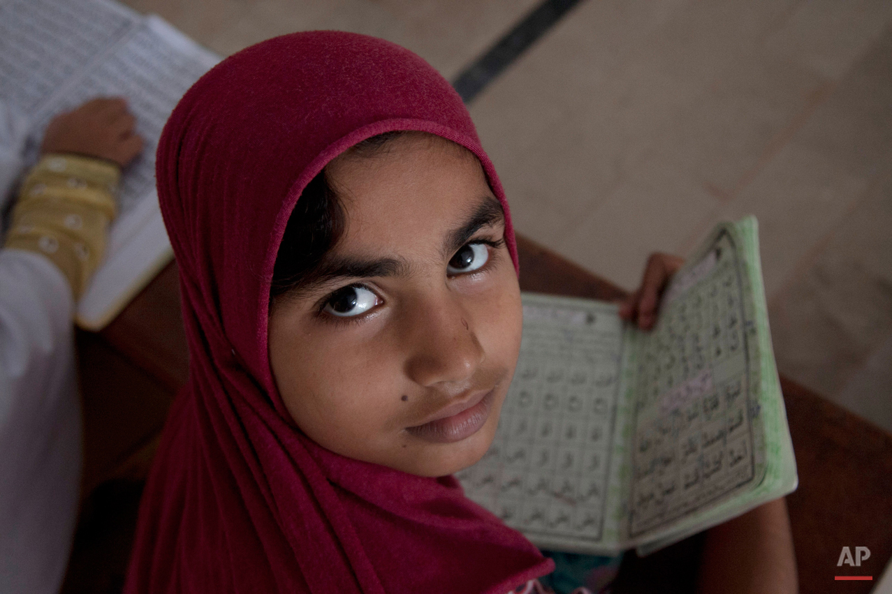  Pakistani girls attend madrassa or a religious school to learn Quran, in Karachi, Pakistan, Monday, Aug 31, 2015. (AP Photo/Shakil Adil) 