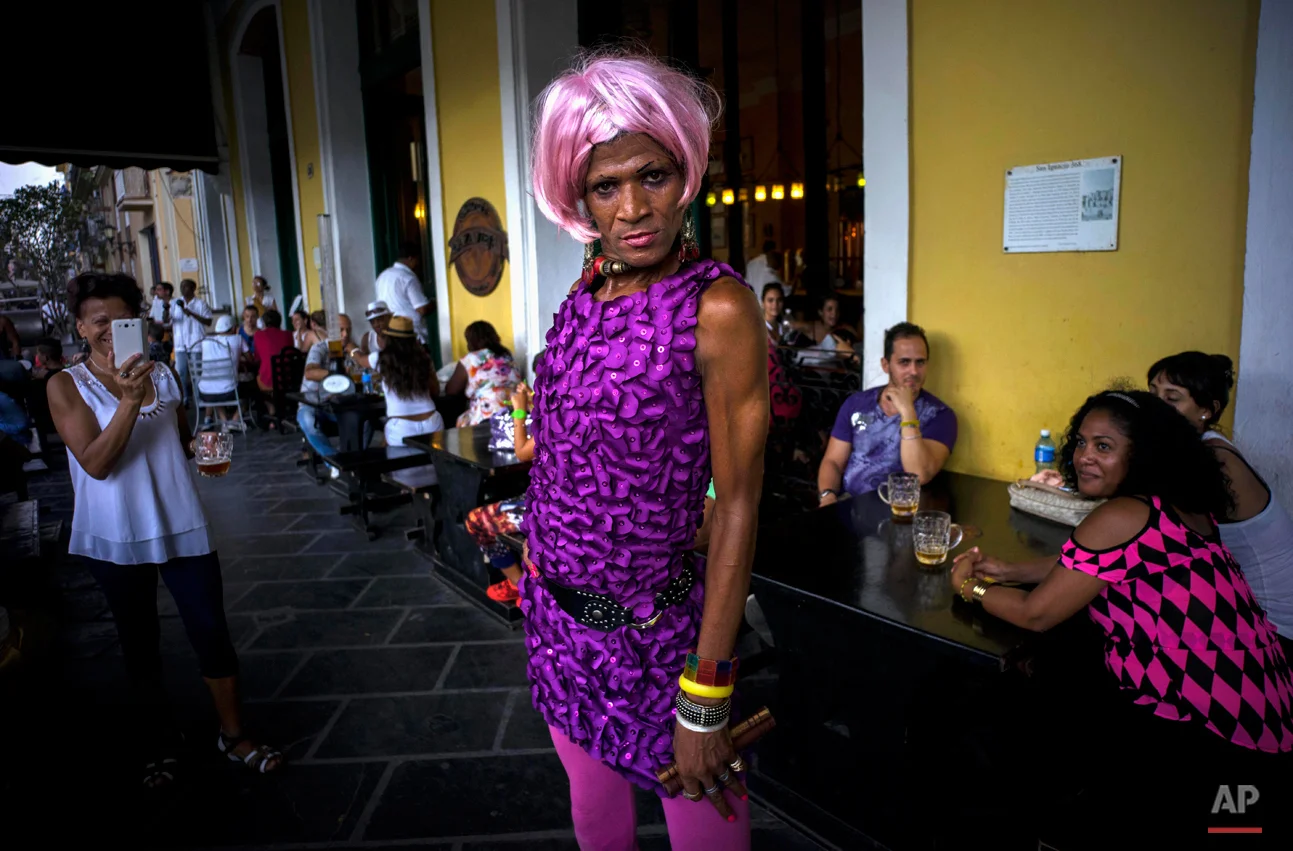 The transvestite artistically known as "Fasaray" performs for tourists in Old Havana, Cuba, Sunday, Aug. 2, 2015. (AP Photo/Ramon Espinosa)